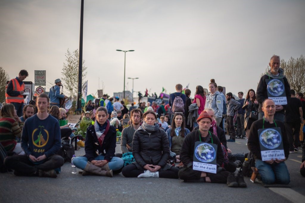 Extinction Rebellion activists block Waterloo Bridge in meditation